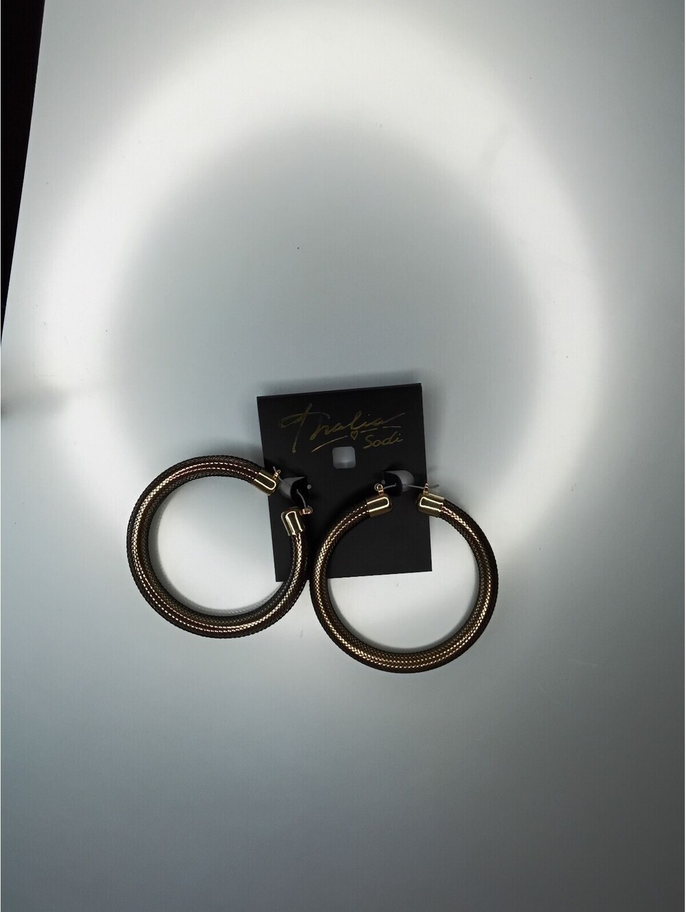 Thalia Sodi gold and black hoop earrings